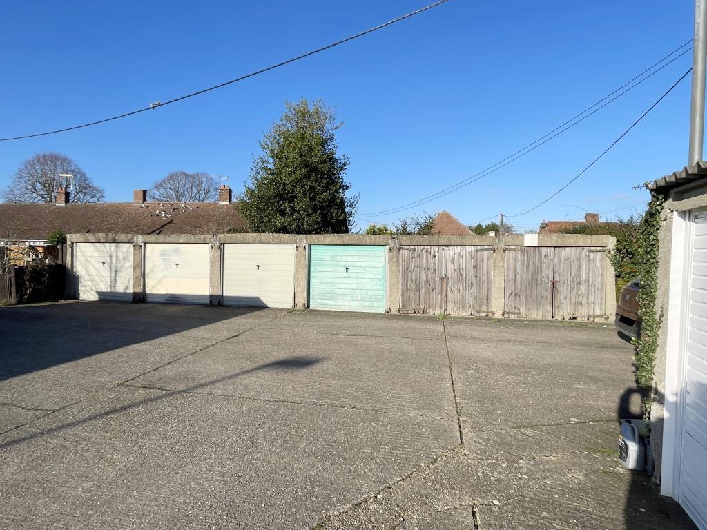 Lot: 65 - COMPOUND OF NINETEEN GARAGES AND LAND - Six of nineteen garages in a compound in village